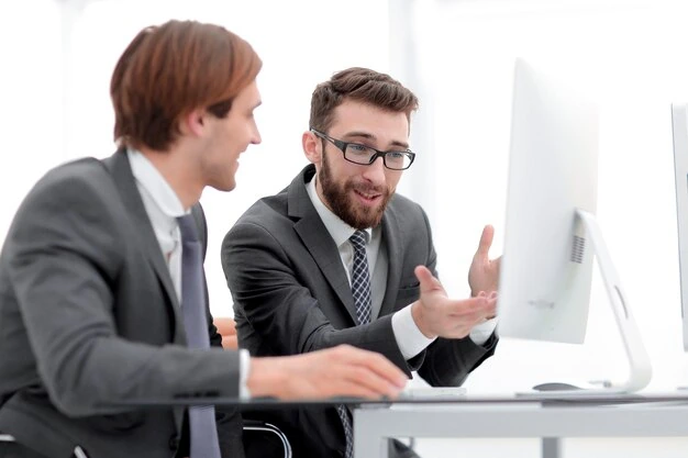 business-partners-discussing-Email-marketing-while-working-on-computer-in-office